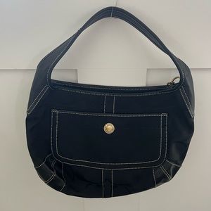 Coach bag. Black C’s fabric with leather trip and strap.